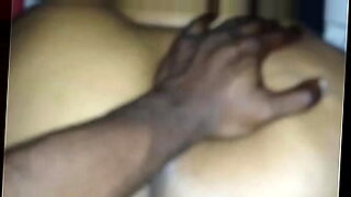 spreading his ebony lover in bed with his raging cock