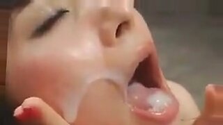 amateur asian chick at home with two guys gets a blowjob